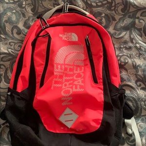 bring pink north face book bag